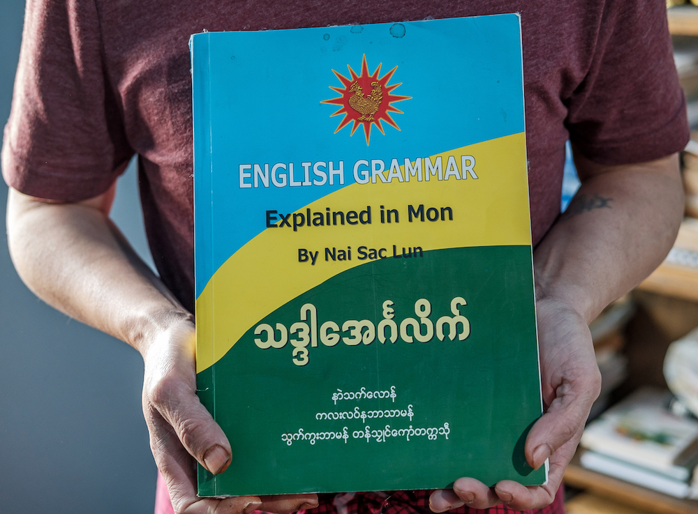 Nai Sac Lun has an English grammar book in Mon.