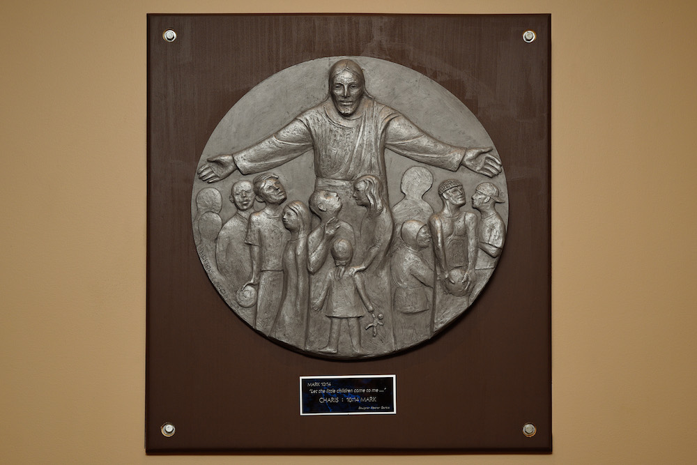 Garcia's “Let The Little Children Come To Me...” plaque (2015) is located in the Charis House.