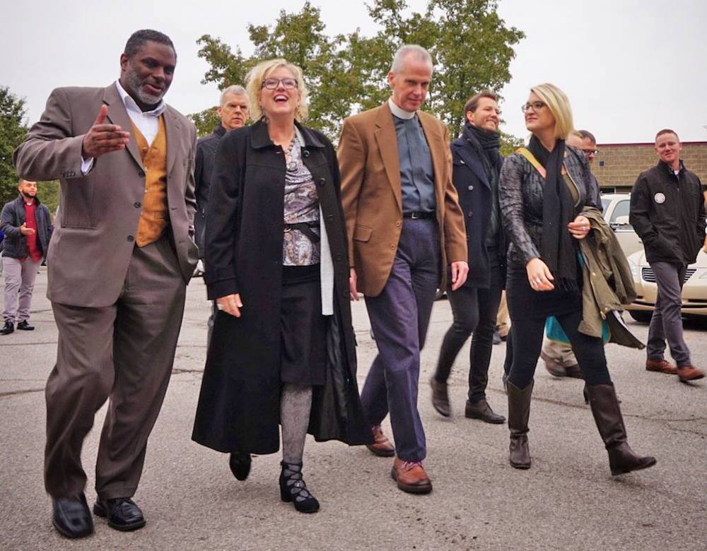 Schaefer, right, joins Trinity English staff and members of Fort Wayne UNITED in a neighborhood walk.