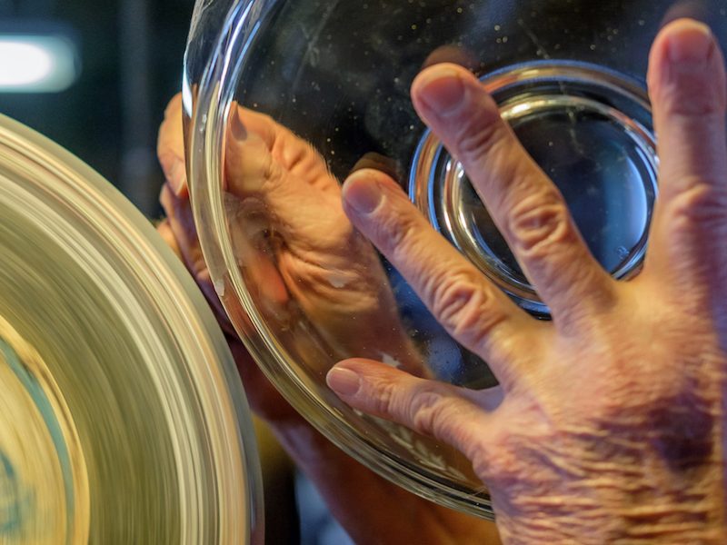 Randy hand-cuts a glass bowl at Warsaw Cut Glass.