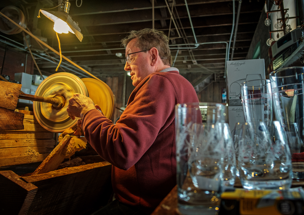 Randy works behind the wheel at Warsaw Cut Glass.