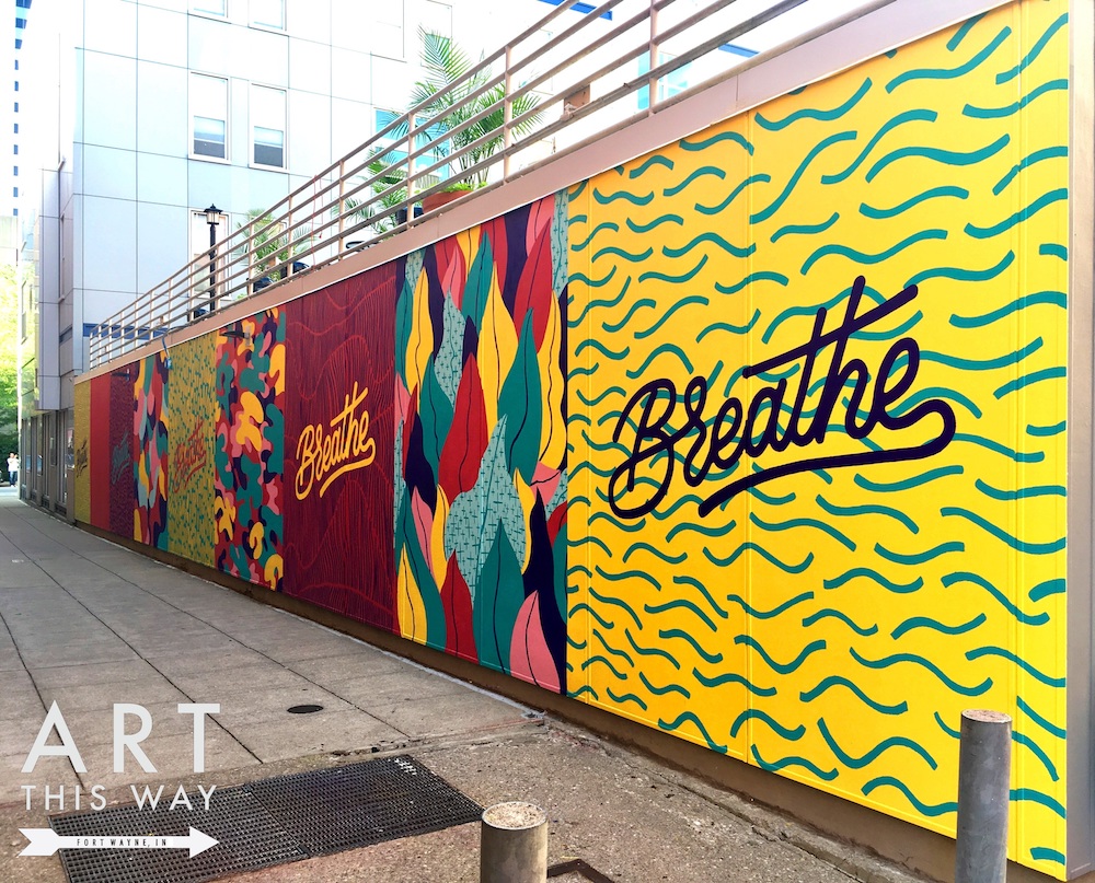 A mural by artist Matt Plett at 112 W. Wayne St. is a series of panels that intermittently read “Breathe.”