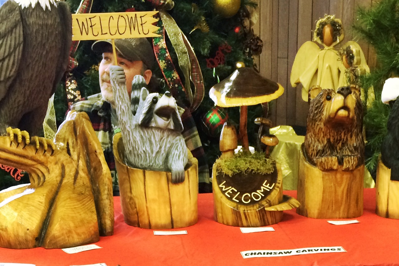 Chainsaw carvings for sale at the Decatur Artisan Craft Market.