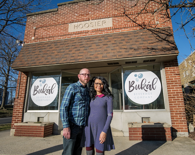 The Johnsons stand outside Bukál's building at 1036 Huffman St.
