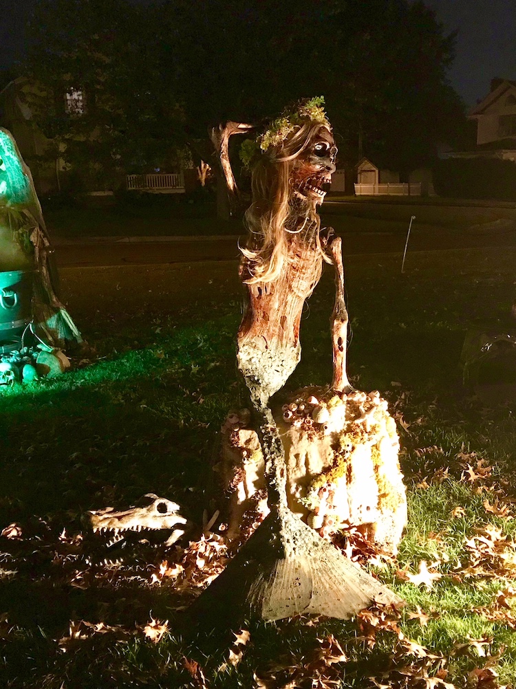 Shawna spends hours preparing the minute details of the display, like gluing barnacles on the Mermaid's rock.