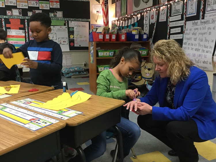 East Allen County Schools Superintendent Marilyn Hissong, right, visits with students.