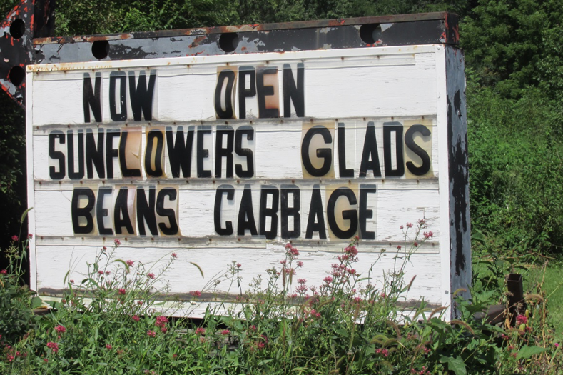 The Flotow’s sign lets passersby on Highway 24 know what is in season.