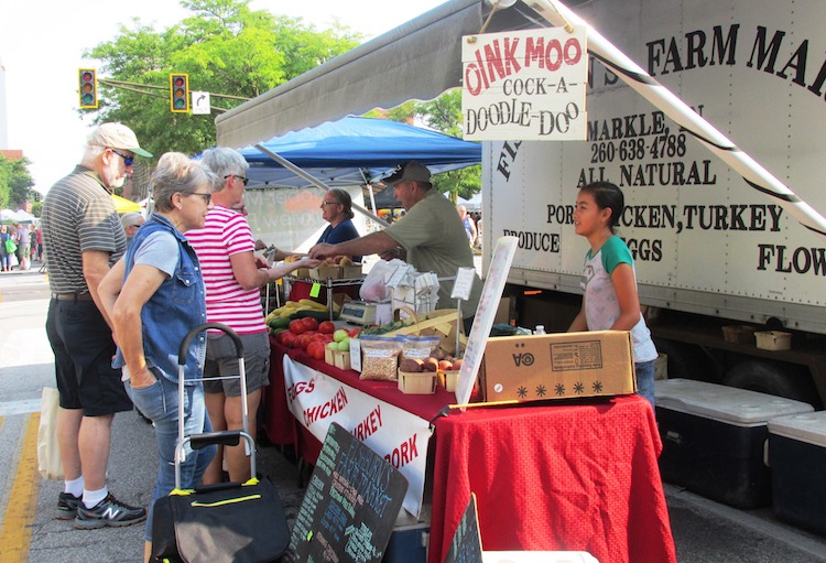 Fresh meat and vegetables draw customers to the Fishburn’s stand.