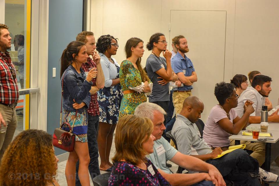 Attendees at Venture Cafe St. Louis listen at an event.