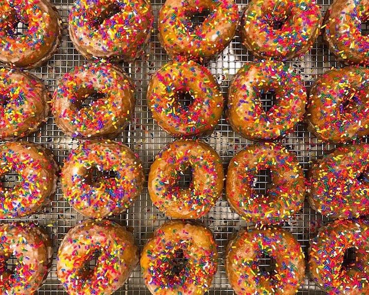 Hetty Arts makes all kinds of donuts from Sour Cream Old Fashioneds to these festive Rainbow Sprinkle Cakes.