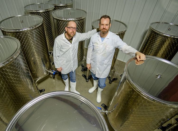 Robert Johnson, left, and Tom Brookshire, right, at Crossroads Kombucha.