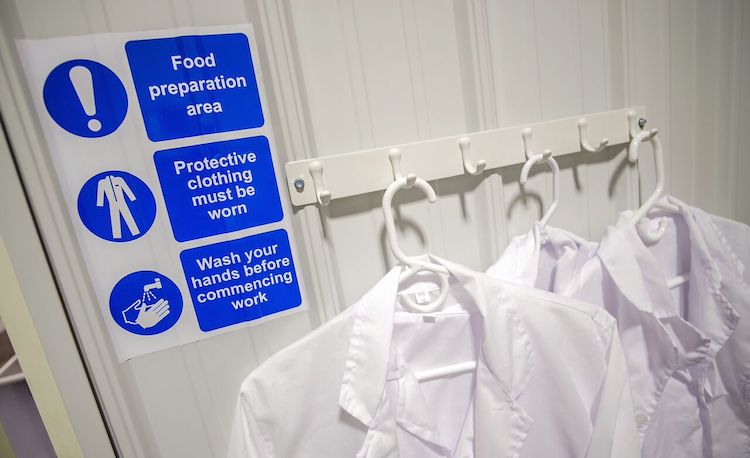 To prevent contamination, Crossroads Kombucha has a prep area that is sealed off, requiring full body suits, gloves, and hairnets.