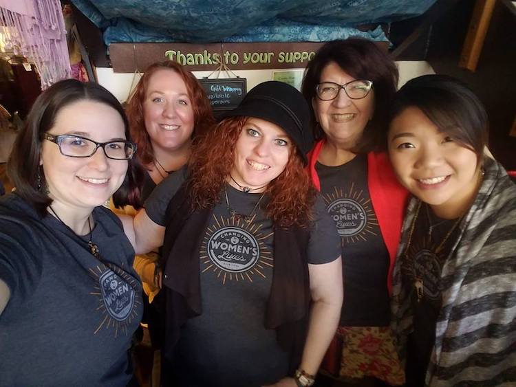 Vanessa Sheckler, center, and Lorelei VerLee, to her right, with their team at Creative Women of the World.