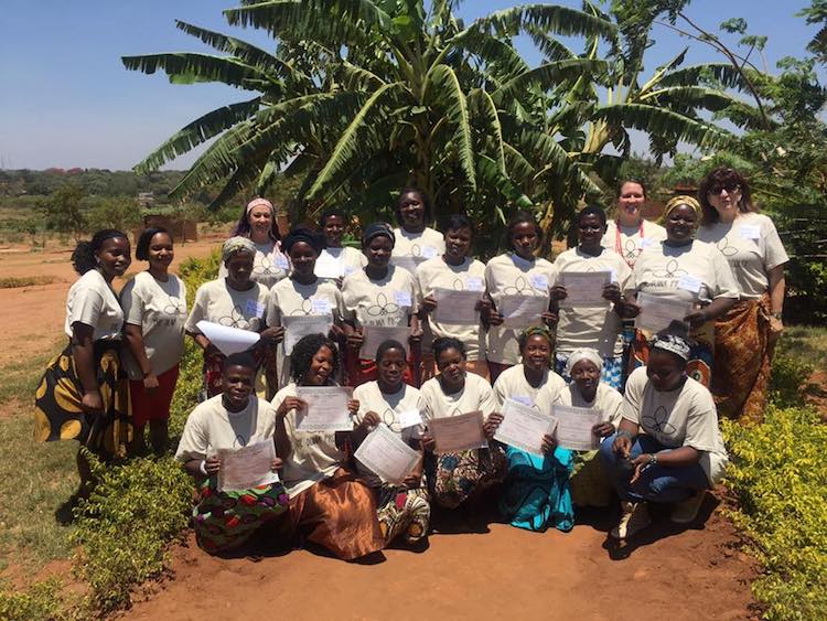 Lorelei VerLee, right, teaches business training to women in the Kauma slums in Lilongwe, Malawi.