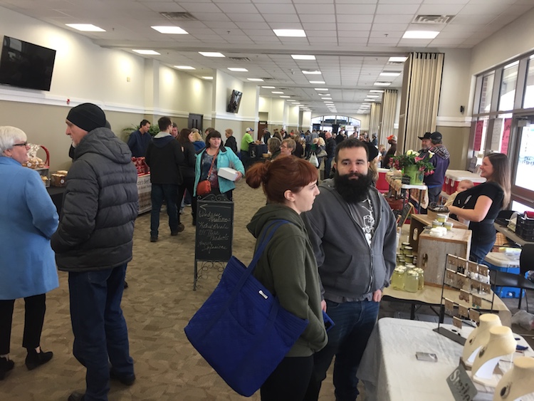 Residents crowd the Fort Wayne Farmers Market at Parkview Field to buy local.
