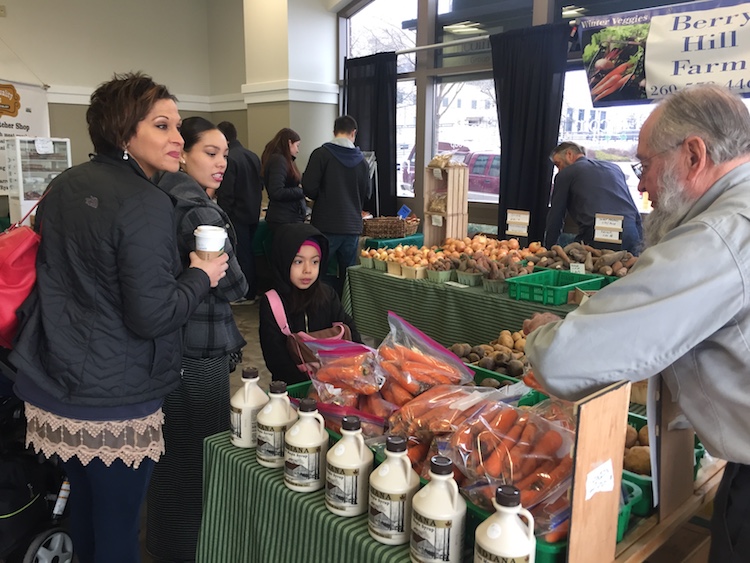 City residents chat with representatives from Berry Hill Farm.