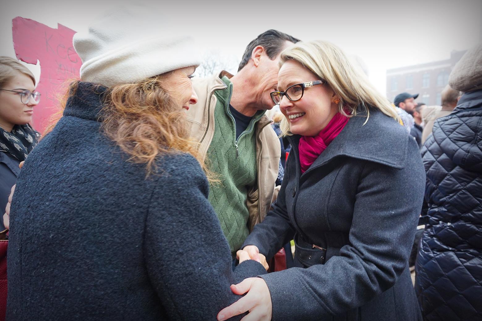 Congressional candidate Courtney Tritch, right, meets with demonstrators at the Women's March.