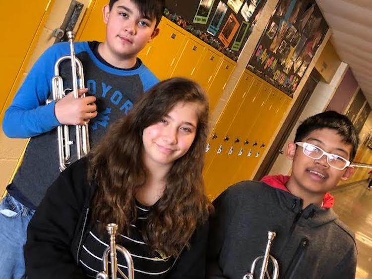 Seventh grade b instrumental students from left, Eli, Merisa, and Zaw.