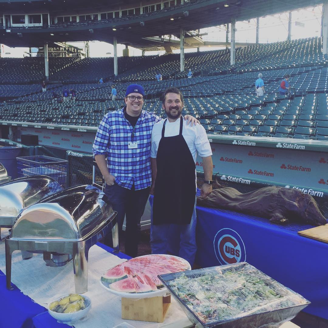 Greg Gunthorp, right, prepares for a pig roast at Wrigley Field in 2016.