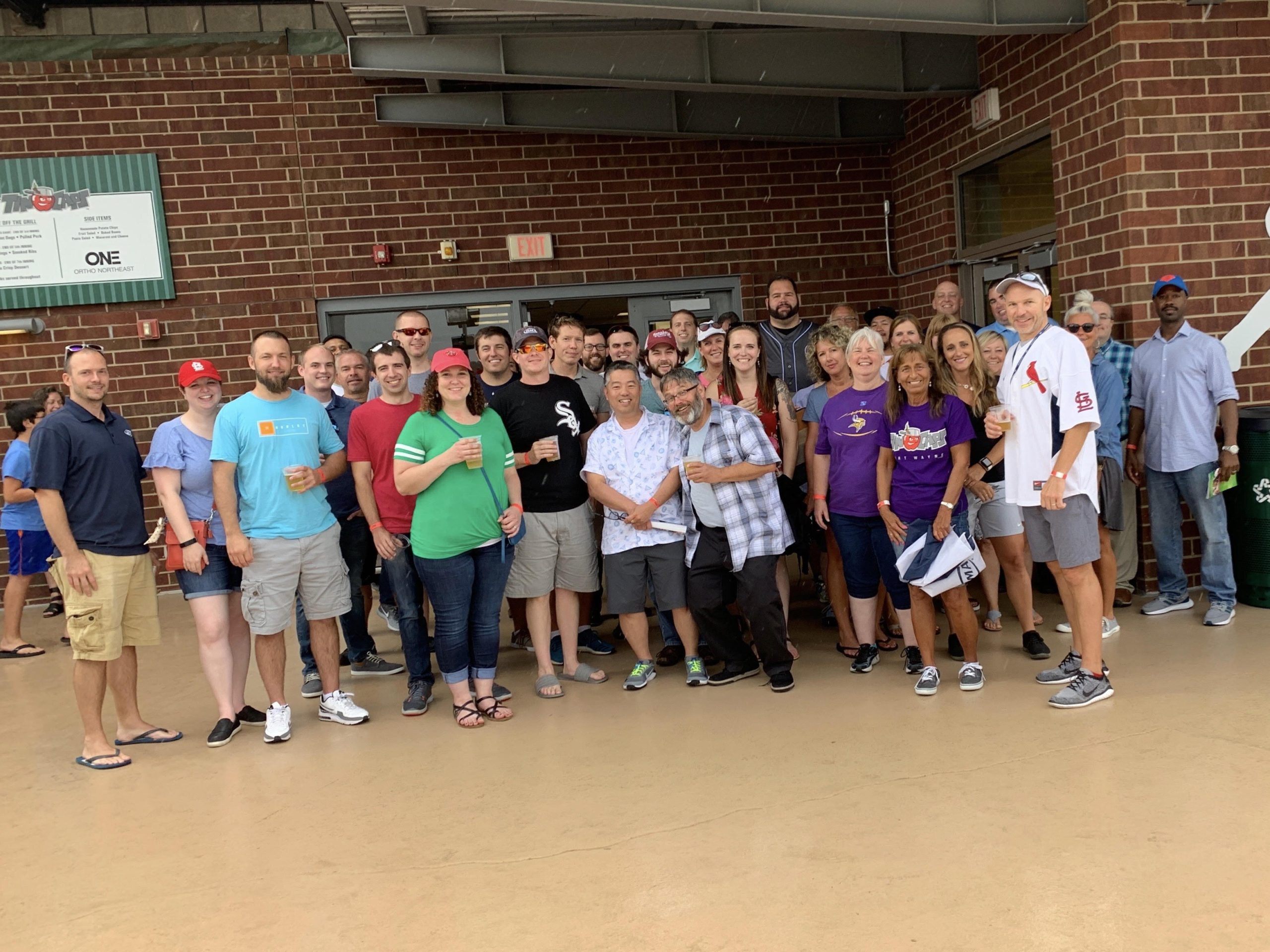 The team at DMA enjoys a Tincaps game together at Parkview Field.