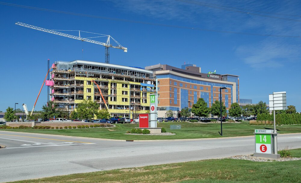 A new 6-story tower is under construction next to the 7-story current tower.