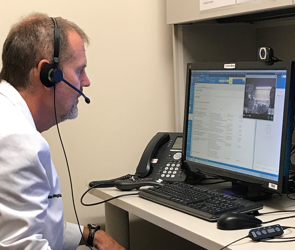 Dr. Mark O’Shaughnessy, Cardiologist, demonstrates the equipment used in virtual consultations with patients in community hospitals. 