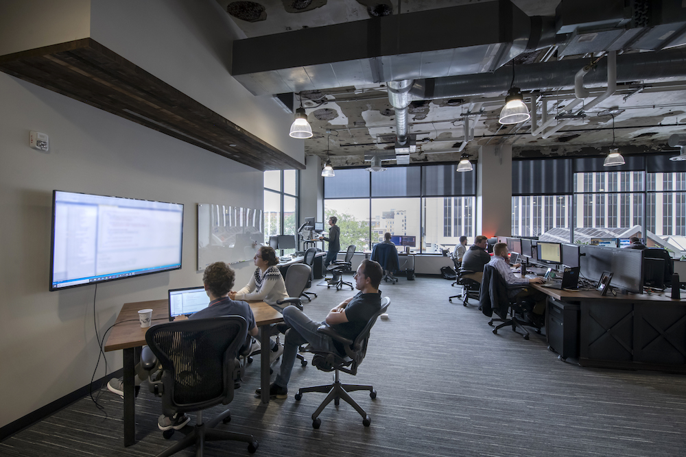 Aptera employees collaborate on the second floor of their downtown office.