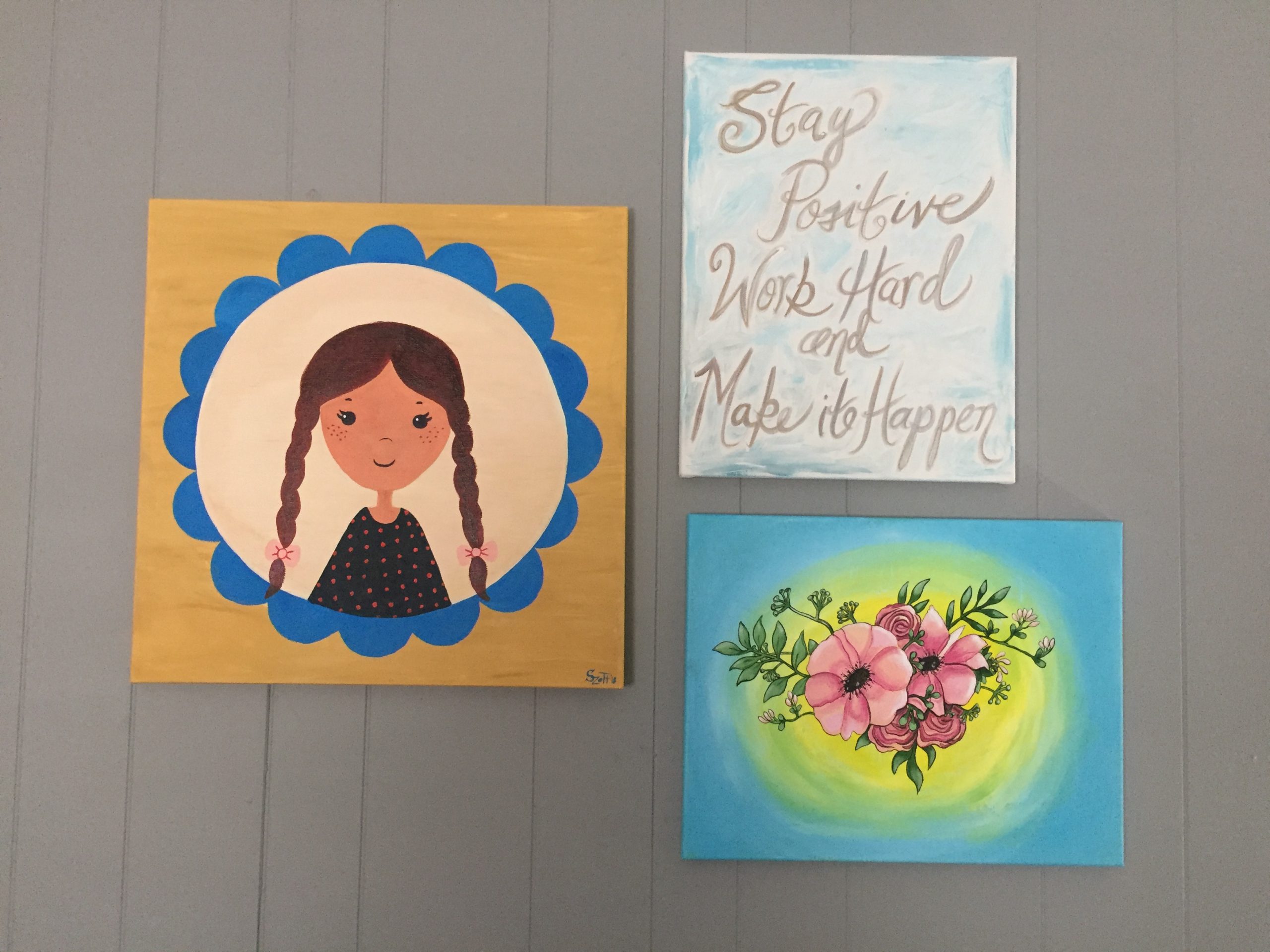 Artwork made by students at Vincent Village decorates the walls.