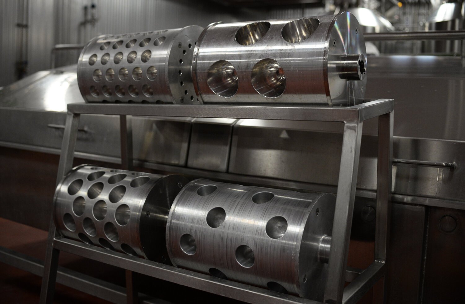 A machine that creates various sizes of mozzarella balls is included with the various equipment at the Golfo di Napoli Dairy.