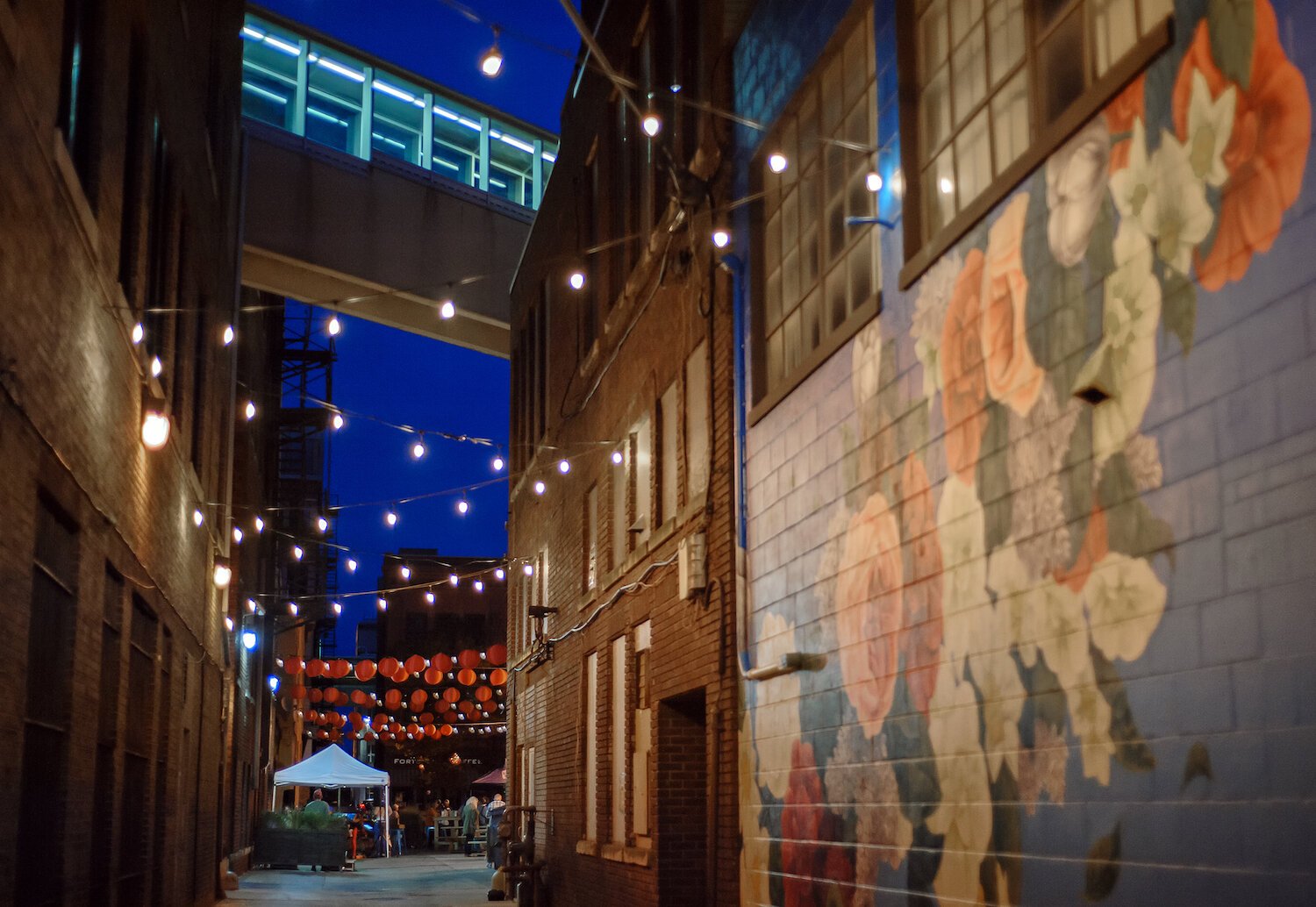 The Porch Off Calhoun combines murals with lights, lanterns, games, and places to hang out.