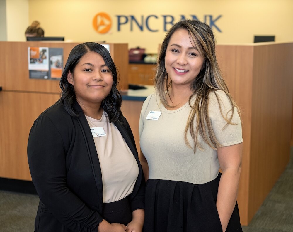 Khin Cho, left, and Carol Sunderman, right, of PNC Bank.