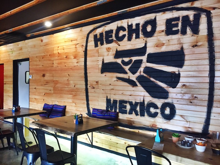 A new wooden wall and tables are part of La Fogata's renovations.