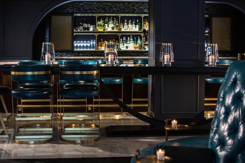 Modern touches and moody colors set the tone for the Allegro's speakeasy vibe.