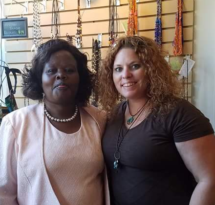 Vanessa Sheckler poses with Kenyan artist Milka. Milka has taken CWOW's business training with several women around her community.