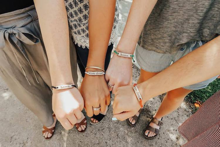 MudLOVE bracelets and mugs often have encouraging words stamped on them.