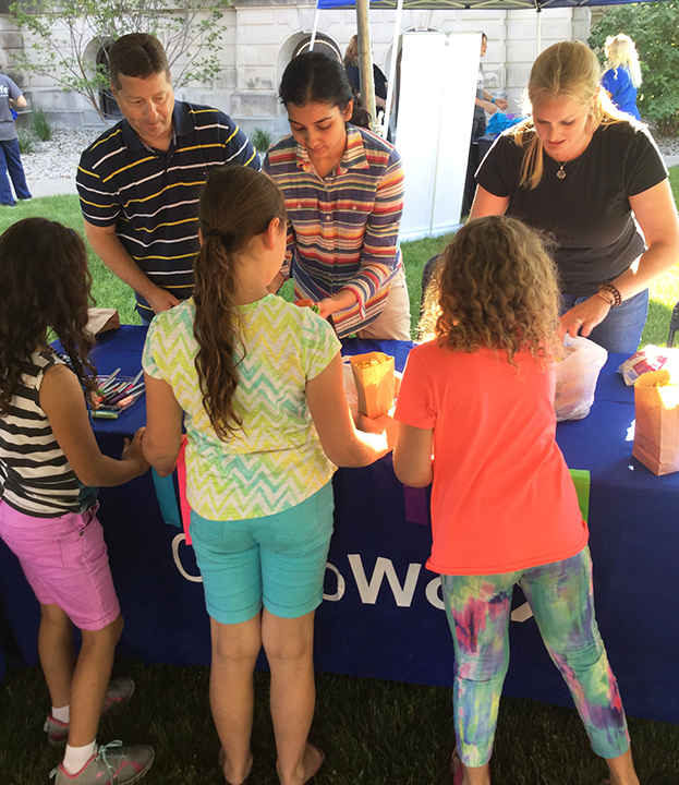 Members of the OrthoWorx Diversity Committee introduce children to different world cultures.