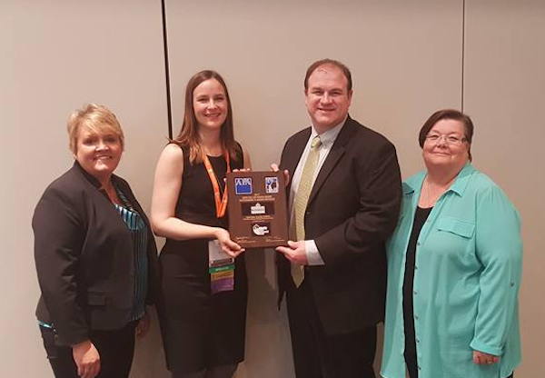 Members of the NewAllen Alliance accept their John Keller Award for Outstanding Planning Initiative from the American Planning Association.