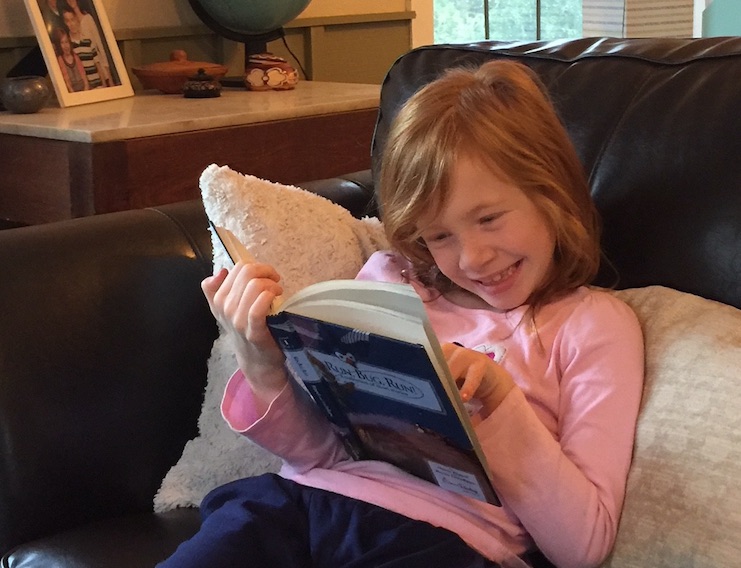 The FWCL encourages students like Bella to read books at home.