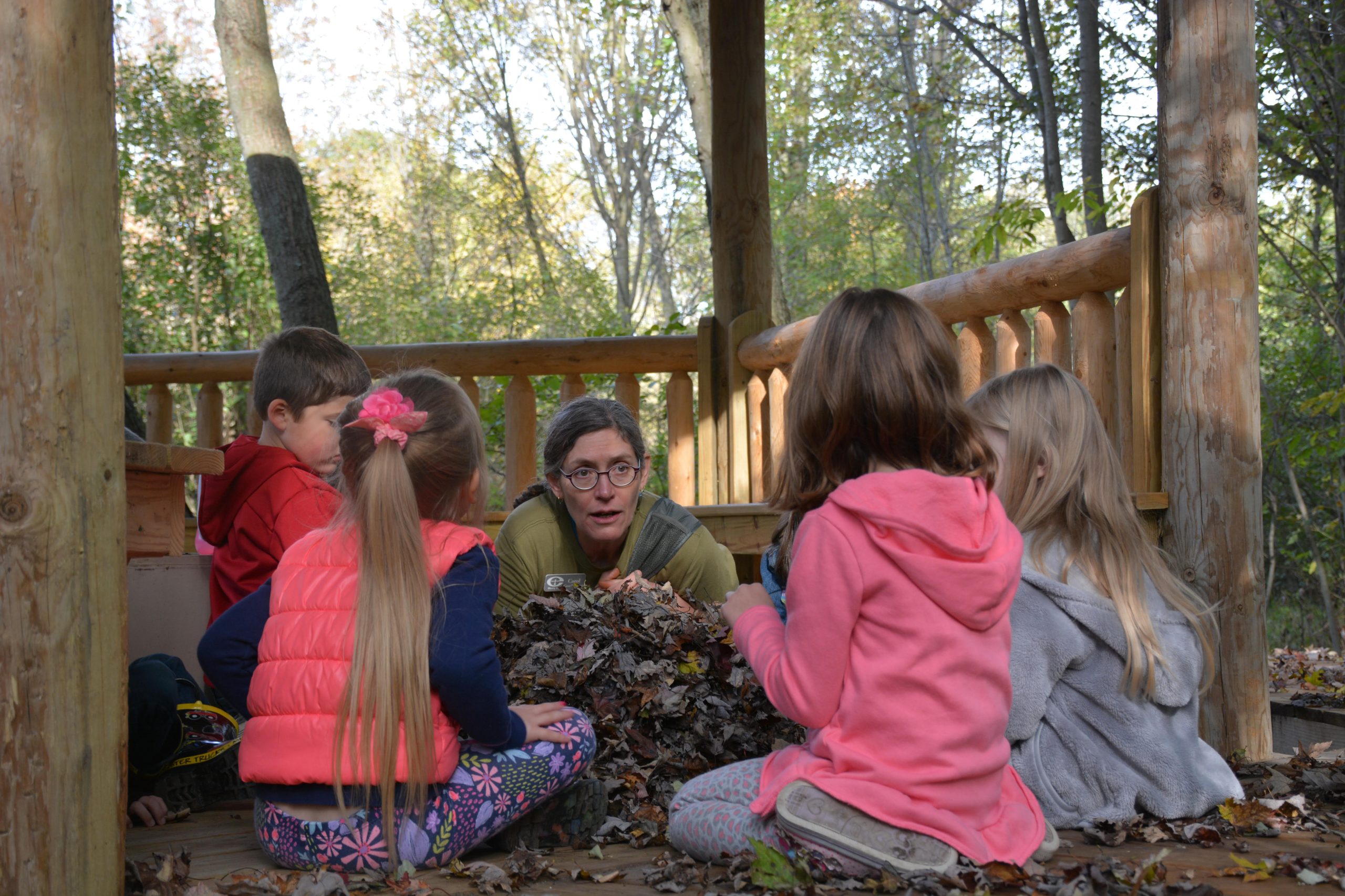 Environmental Educator Carol Good Elliott works with children during an Autumn Adventures program. 