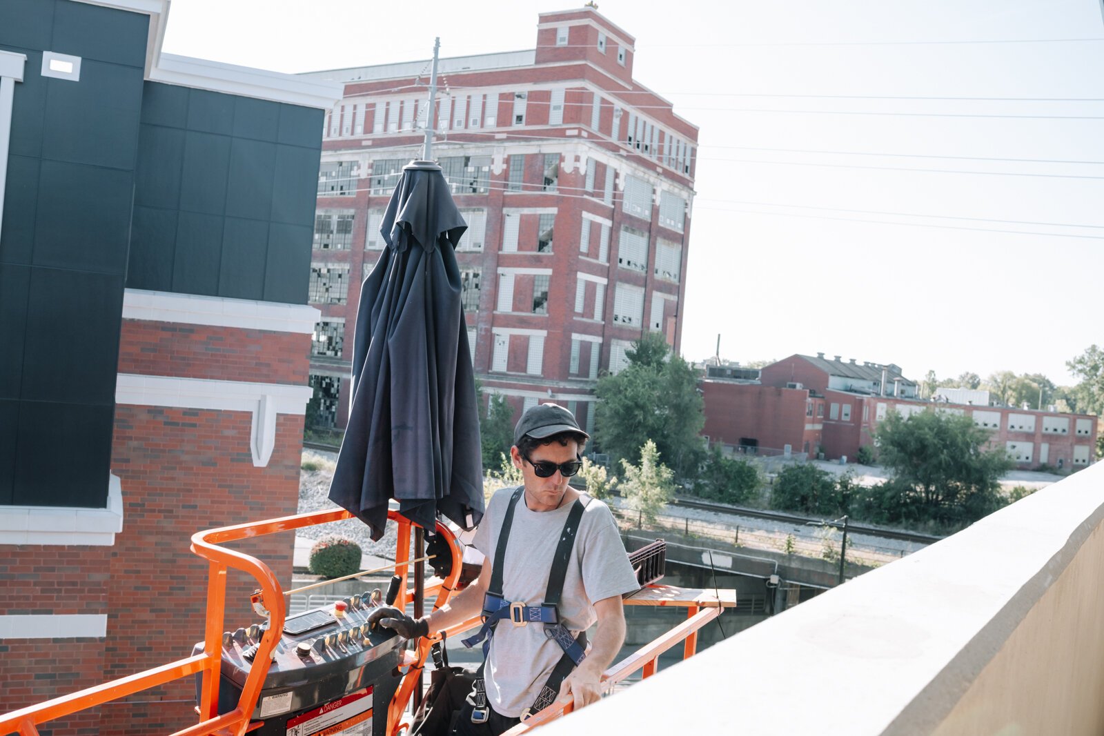 Muralist Damien Mitchell works on his 15,000 square foot mural on the Union Parking Garage at Electric Works on September 12, 2025.