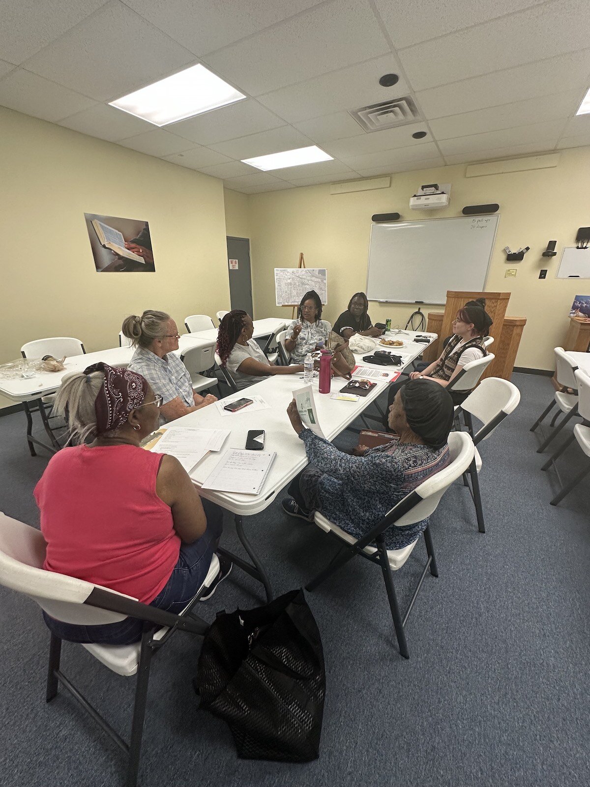 Memorial Park residents vote on their new logo at a recent meeting.