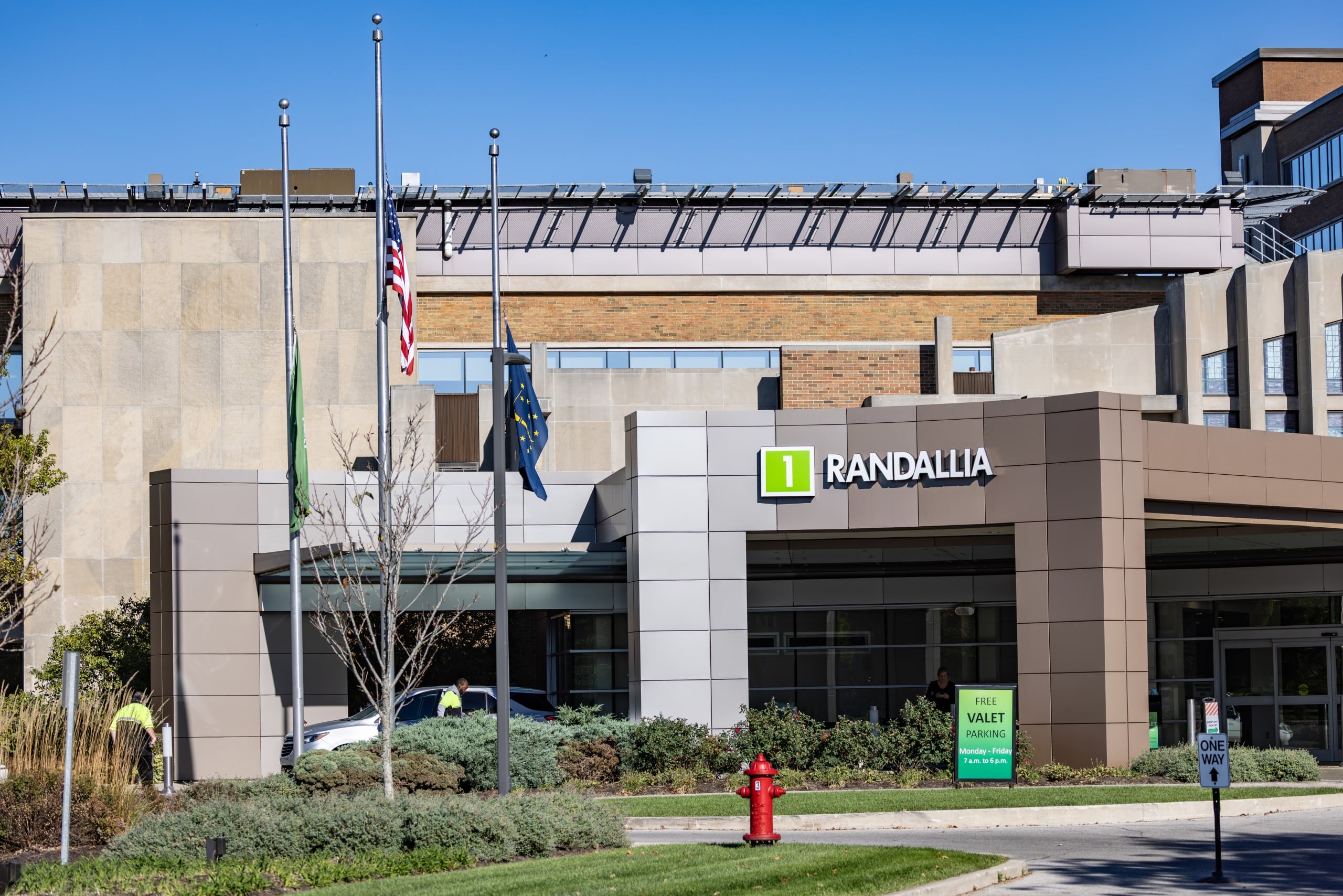 A grey, square arch reads, "1, Randallia" in front of a hospital entrance.