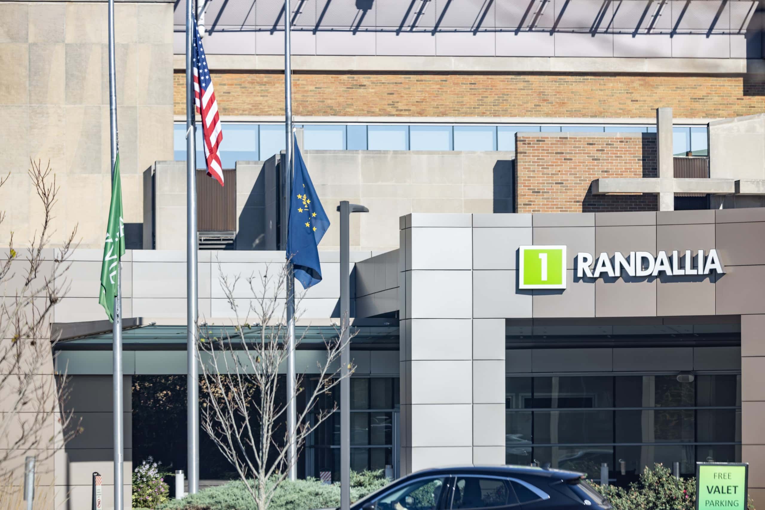 A grey, square arch reads, "1, Randallia" in front of a hospital entrance.