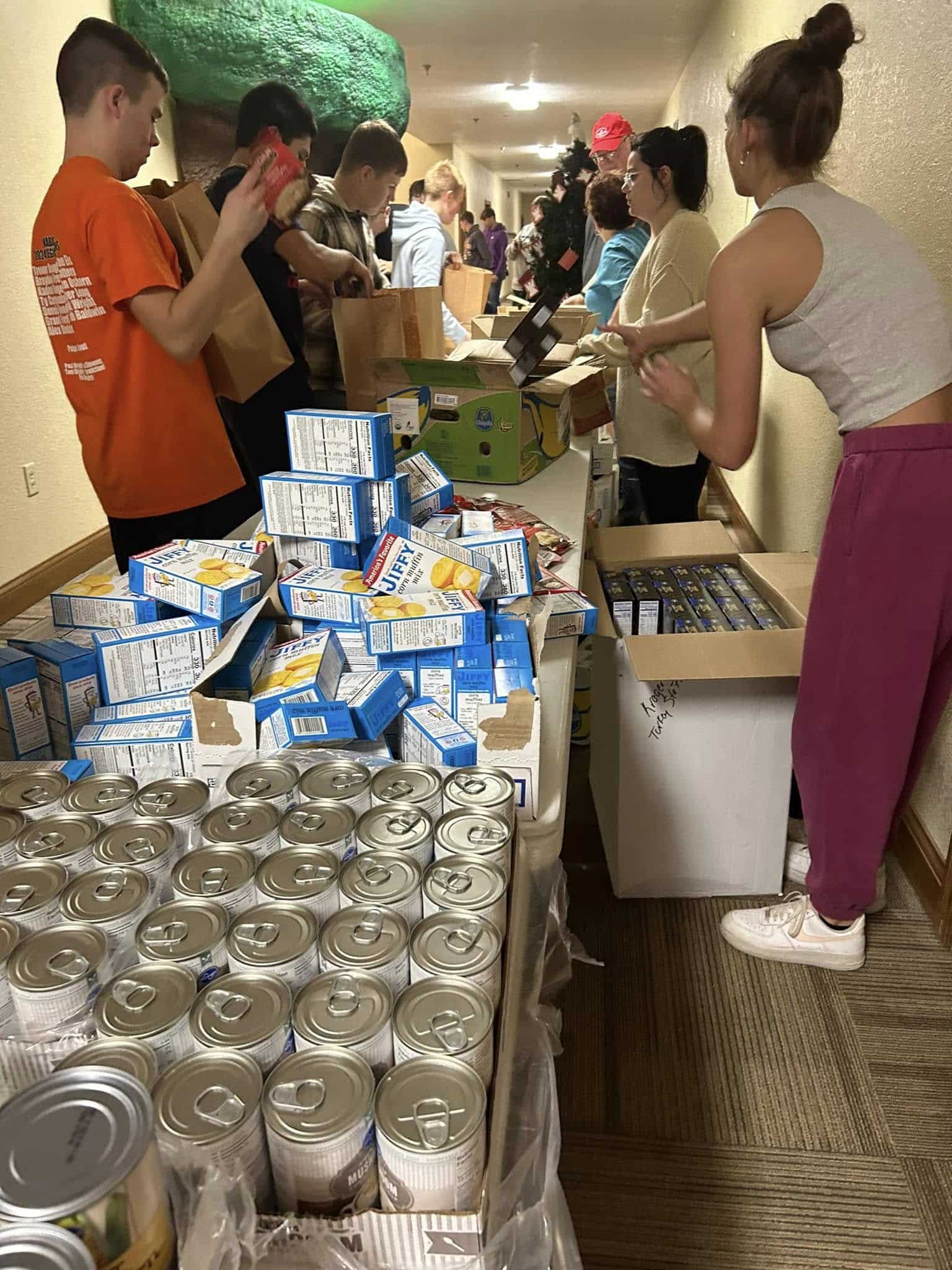 Wabash High School students packing Thanksgiving food bags for Lighthouse Mission.